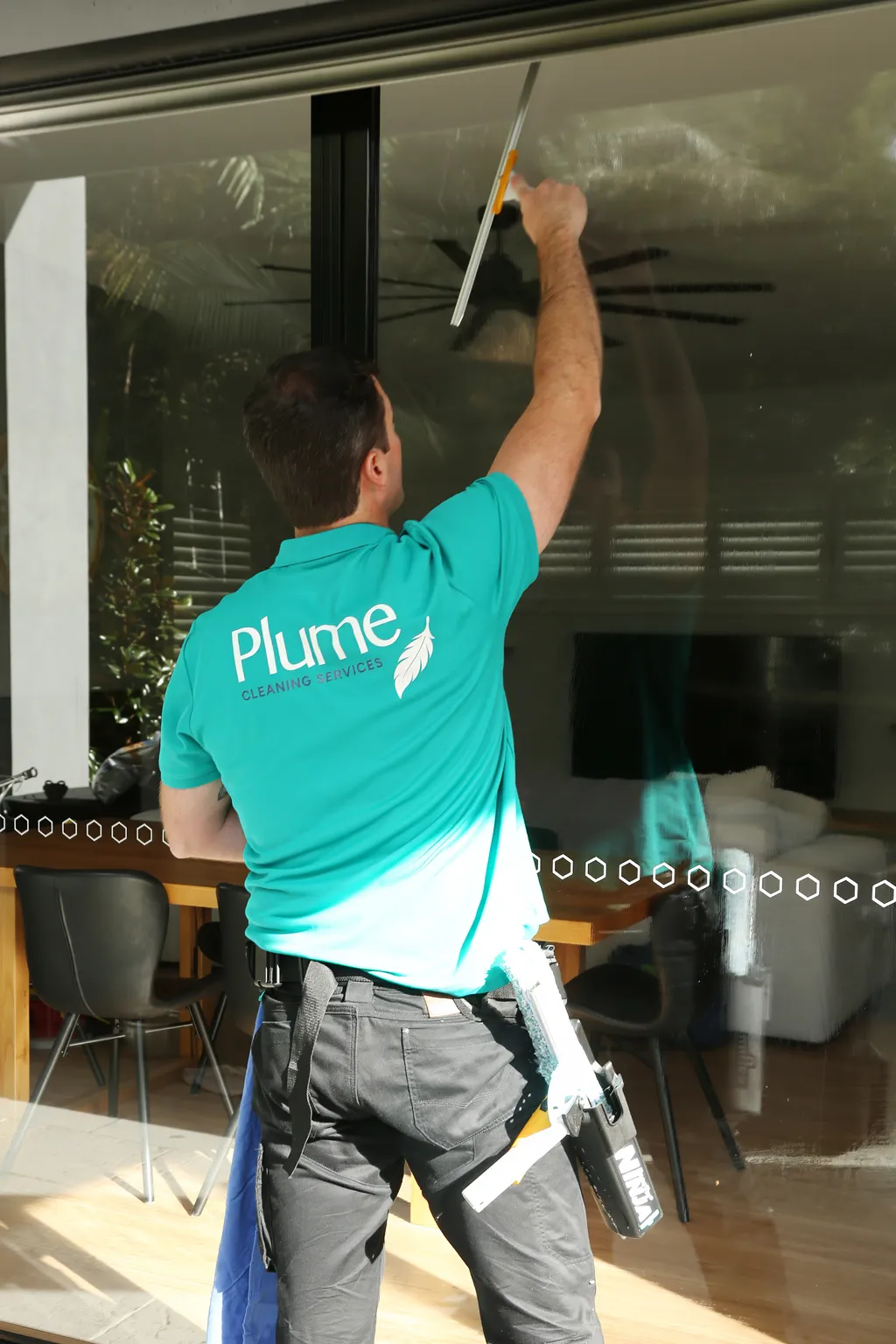 Joel squeegeeing a window